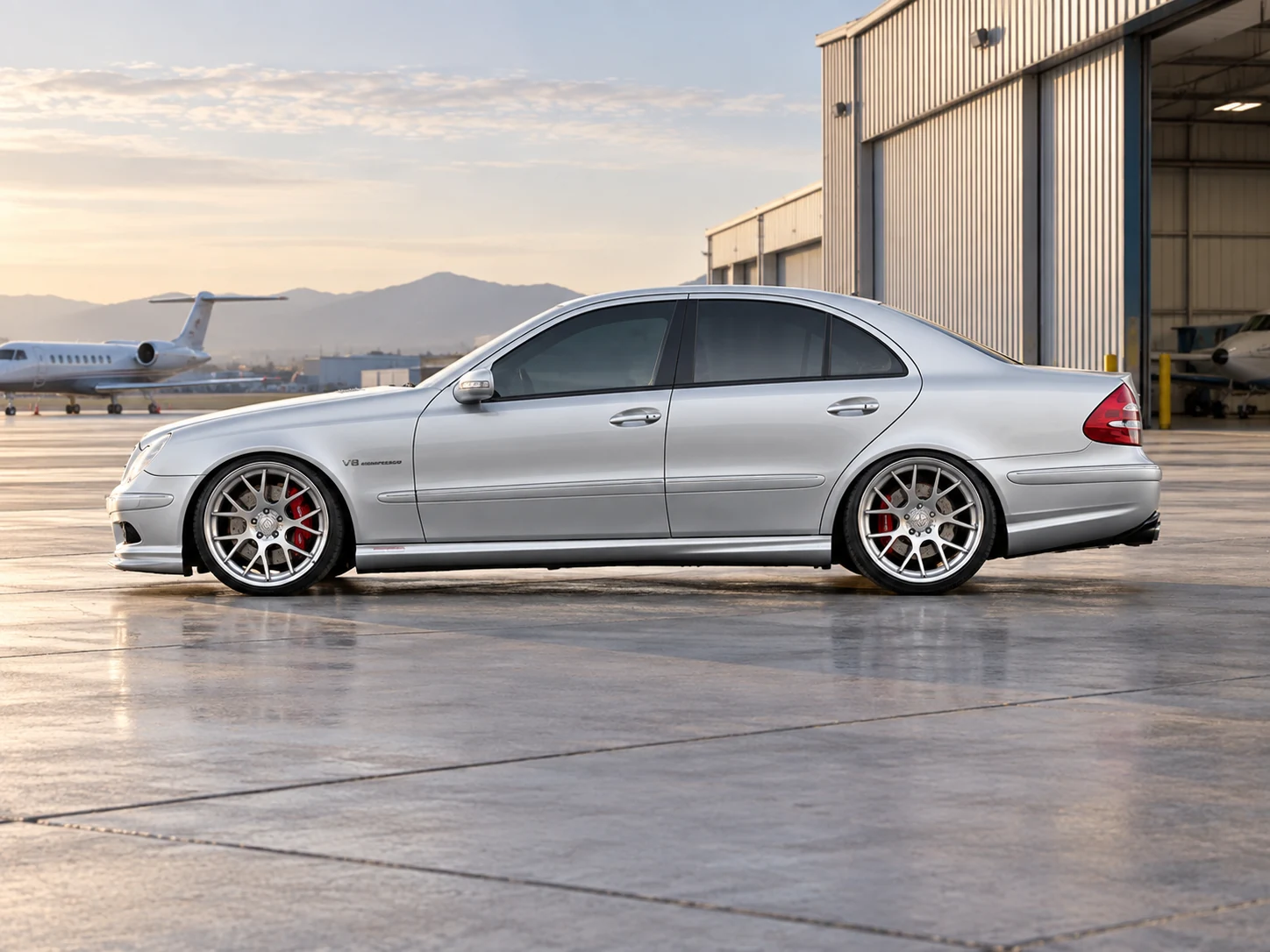 AI-generated view of a 2006 Mercedes-Benz E55 AMG Sedan with Vossen CV2 wheels